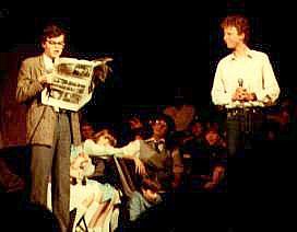 Select this image to see a larger version. "Oh, what a show!" : Mark Oldknow (Martin) (holding a copy of "The Stage") with Andrew Chatfield (Alan). Sarah Collins (Mandy) is seated upstage of them.
