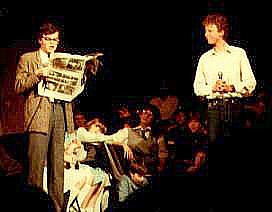 "Oh, what a show!" : Mark Oldknow (Martin) (holding a copy of "The Stage") with Andrew Chatfield (Alan). Sarah Collins (Mandy) is seated upstage of them.
 Select this image to see a larger version. 