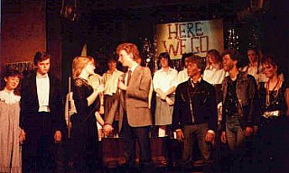 Rachel Day (Cheryl) and Andrew Chatfield (Alan) reprise "Pebbles" at the final curtain call - watched by [from left] Sarah Collins (Mandy); Mark Oldknow (Martin); David Worley (Tony); Chris Barry (Dave) and Sarah Ayres (Kathy) with other cast members behind them.
 Select this image to see a larger version. 