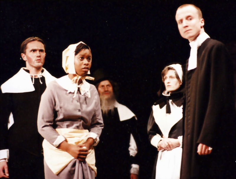 Select this image to see a larger version. Act One: Thomas Putnam (Lawrence Markham), Tituba (Samantha Franklin), Giles Corry (Ian Wagge), Ann Putnam (Debbie Lewis) and John Hale (Andrew Chatfield)

