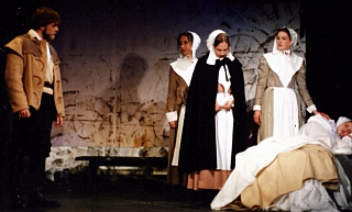 Act One: Proctor (David Worley) with (from L to R) Mercy Lewis (Caitlin Hughes), Mary Warren (Helen Wallace), Abigail Williams (Catherine Lambert) and Betty Parris (Katie Gourd) Select this image to see a larger version. 