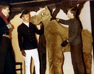 Toad (Rod Baker) watches as Rat (Martin Wallace) and Mole (Andrew Kitchen) do their best to encourage Alfred, the horse (front: Ian Worsfold; back: Richard Lucas) Select this image to see a larger version. 