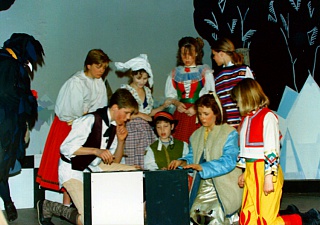Kai (Jeremy Murrell) and Gerda (Claire Garnett) with the other prisoners of the Snow Queen (believed to be:- Anna Fairgrieve; Amy Charles; Elisabeth Brownbill; Tanya Baker; Anharad Rees-Williams and (in front) Gareth Benest) try to work out the key word to rebuild the mirror, watched by Krark (Paul Bacon - left). Select this image to see a larger version. 
