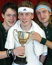 Peter Sharman, Phil Macken and James Cooke brandishing the Barn Theatre Cup from the Eastern Area Final